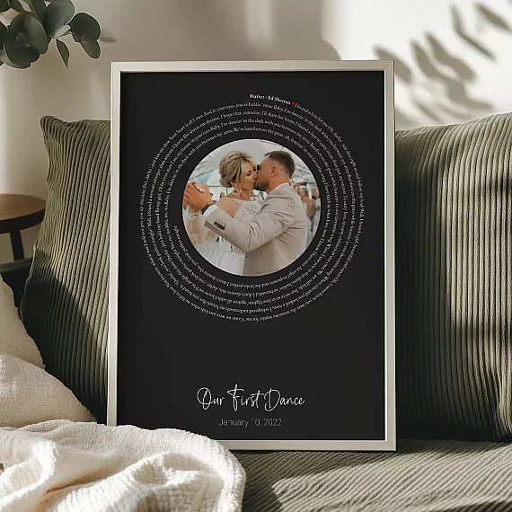 First Dance Song Lyrics with Photo poster with a dark background and wedding photo displayed on a sofa.