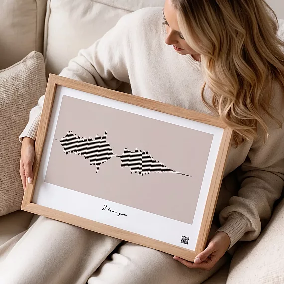 custom voice recording soundwave print in neutral tones displayed on sofa in cozy interior