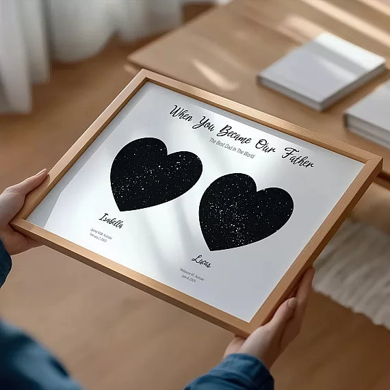 Framed personalized dad constellation poster with two circular star maps on wooden floor.
