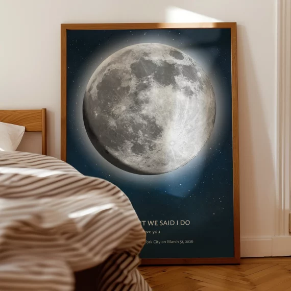 Custom moon phase poster leaning against a bedroom wall showing a detailed full moon on a special date.