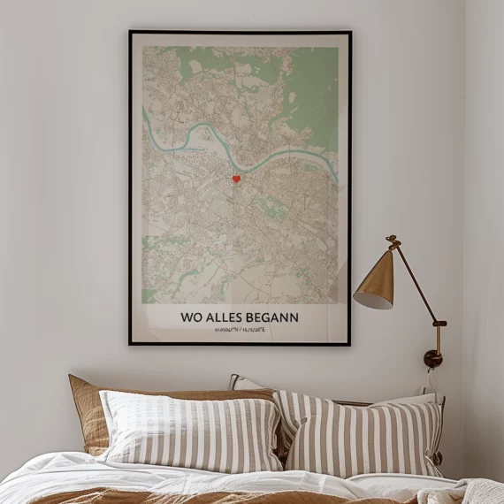Framed Where It All Began personalized map poster displayed above a bed with a heart marking a meaningful location.