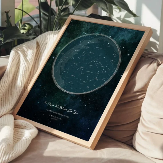 Framed Birthday Star Map with galaxy background displayed on sofa with blanket.