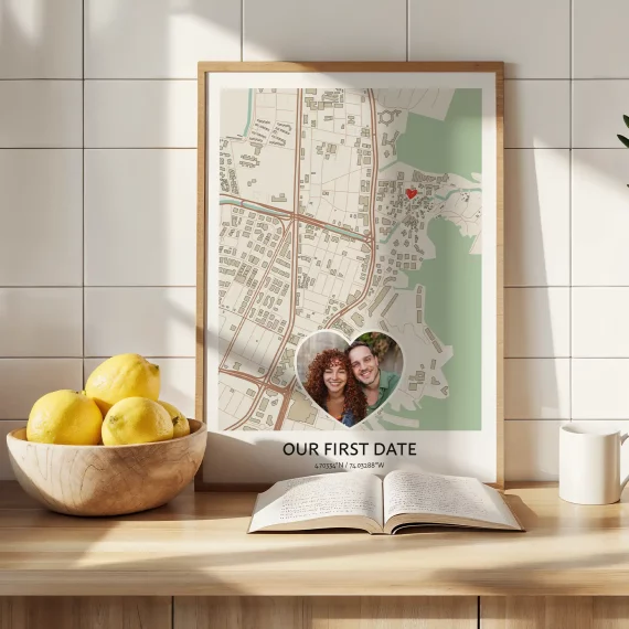 Our First Date Map poster with a couple photo insert and a marked location, displayed on a kitchen counter.