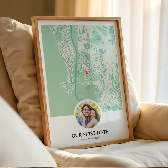 Framed Our First Date Map poster with a couple photo resting on a sofa in a cozy living room.