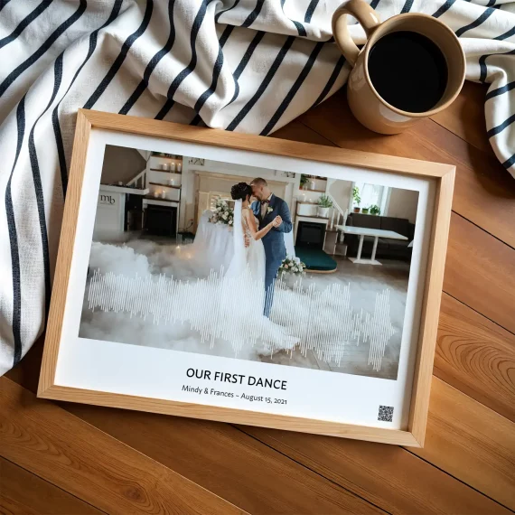 first dance song soundwave art framed wedding print on wooden table with coffee