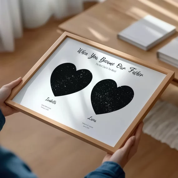 Framed personalized dad constellation poster with two circular star maps on wooden floor.