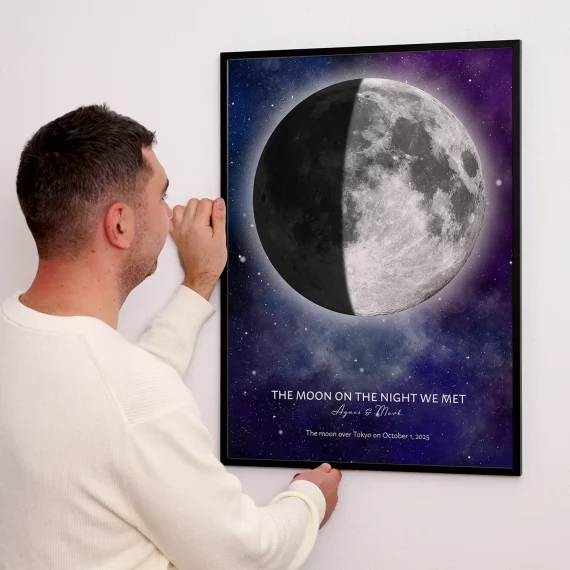 Personalized Moon on the Night We Met print featuring a half moon displayed on a wall.