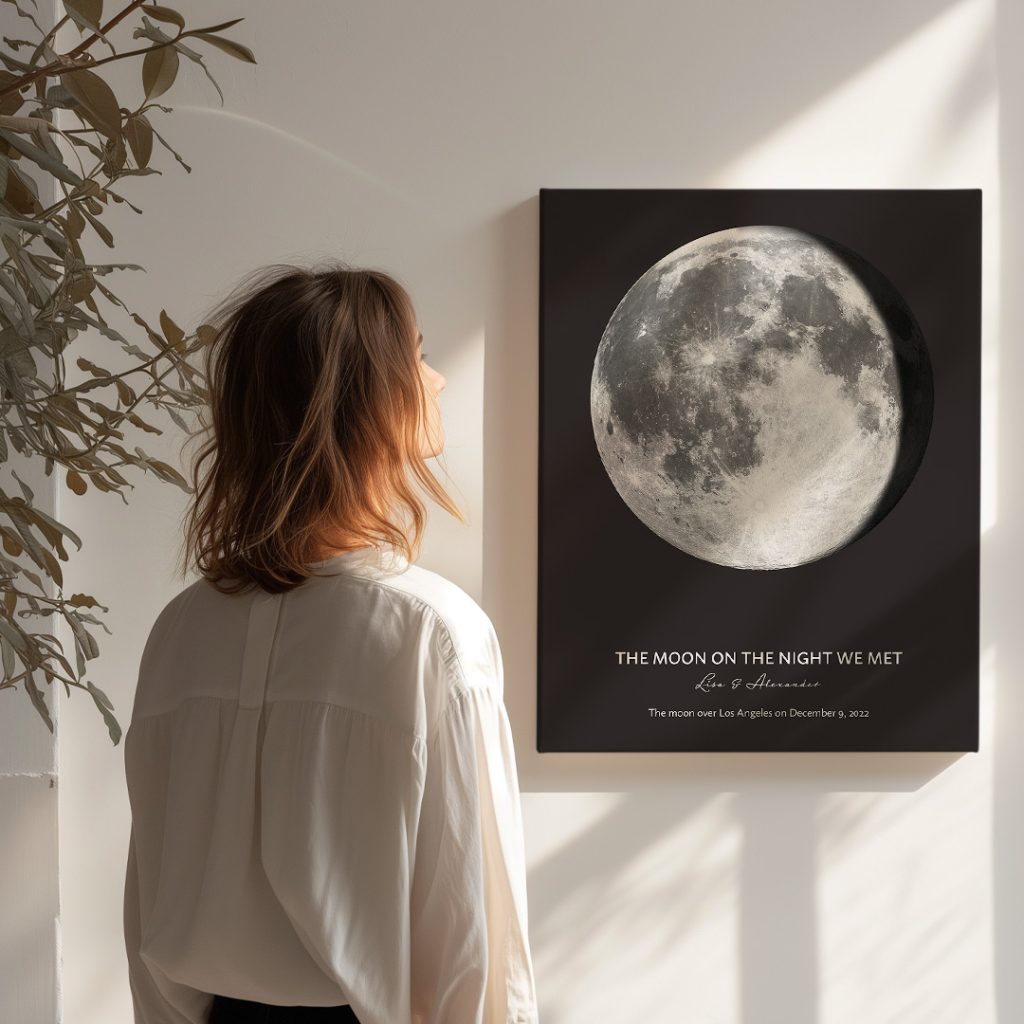 Woman admiring a personalized moon phase canvas showing the moon on the night a couple first met.