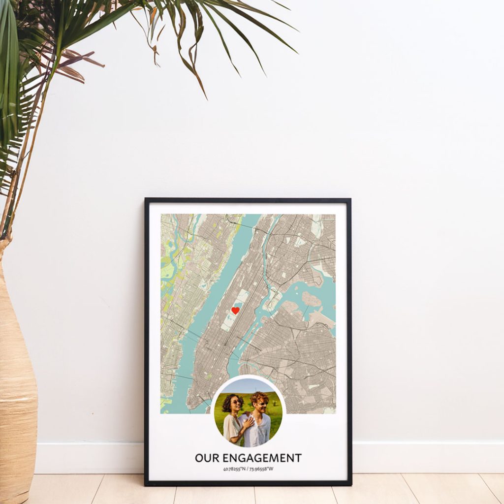 Framed engagement map print with a personal photo, red heart marker, and custom coordinates, showing how to turn meaningful photos into personalized map art