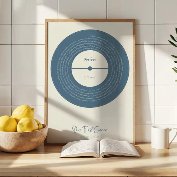 First Dance Song Lyrics with Photo poster featuring a vinyl-style lyrics design displayed on a kitchen counter.