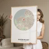 Woman holding a framed personalized “Where We Met” city map, featured as one of 12 personalized Christmas gift ideas for 2026.