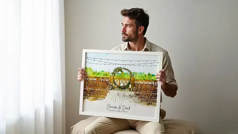 Man holding personalized Christmas gift custom watercolor venue print with names and date personalized wall art for him