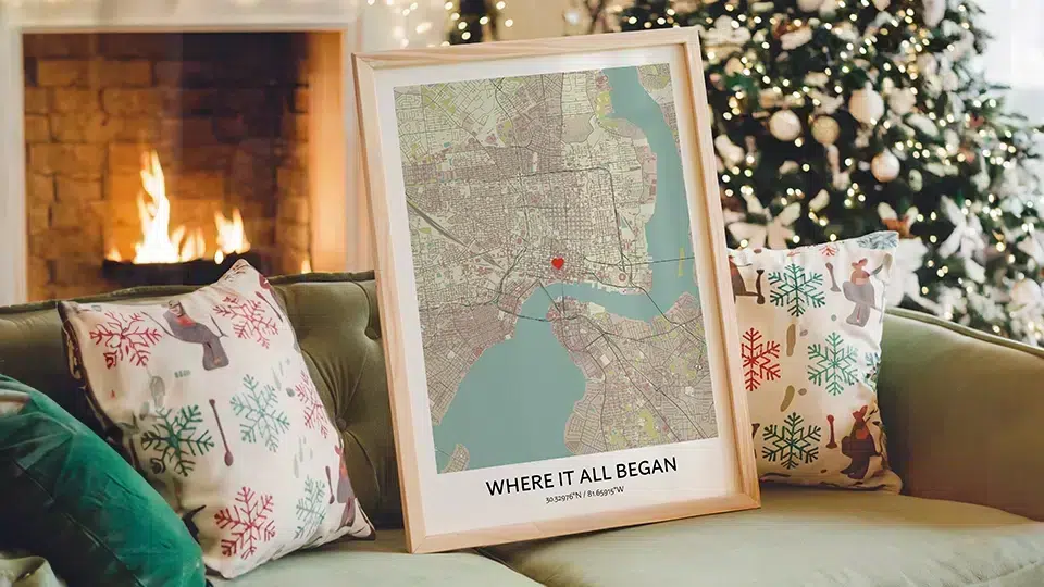 Meaningful Christmas gift Where It All Began custom map displayed on couch by fireplace and decorated Christmas tree