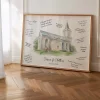 Large framed wedding guest book alternative with a watercolor church venue portrait and handwritten guest messages displayed in a bright interior.