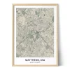 Framed personalized city map of Matthews, USA, featuring detailed streets, major roads, green areas, waterways, and geographic coordinates.