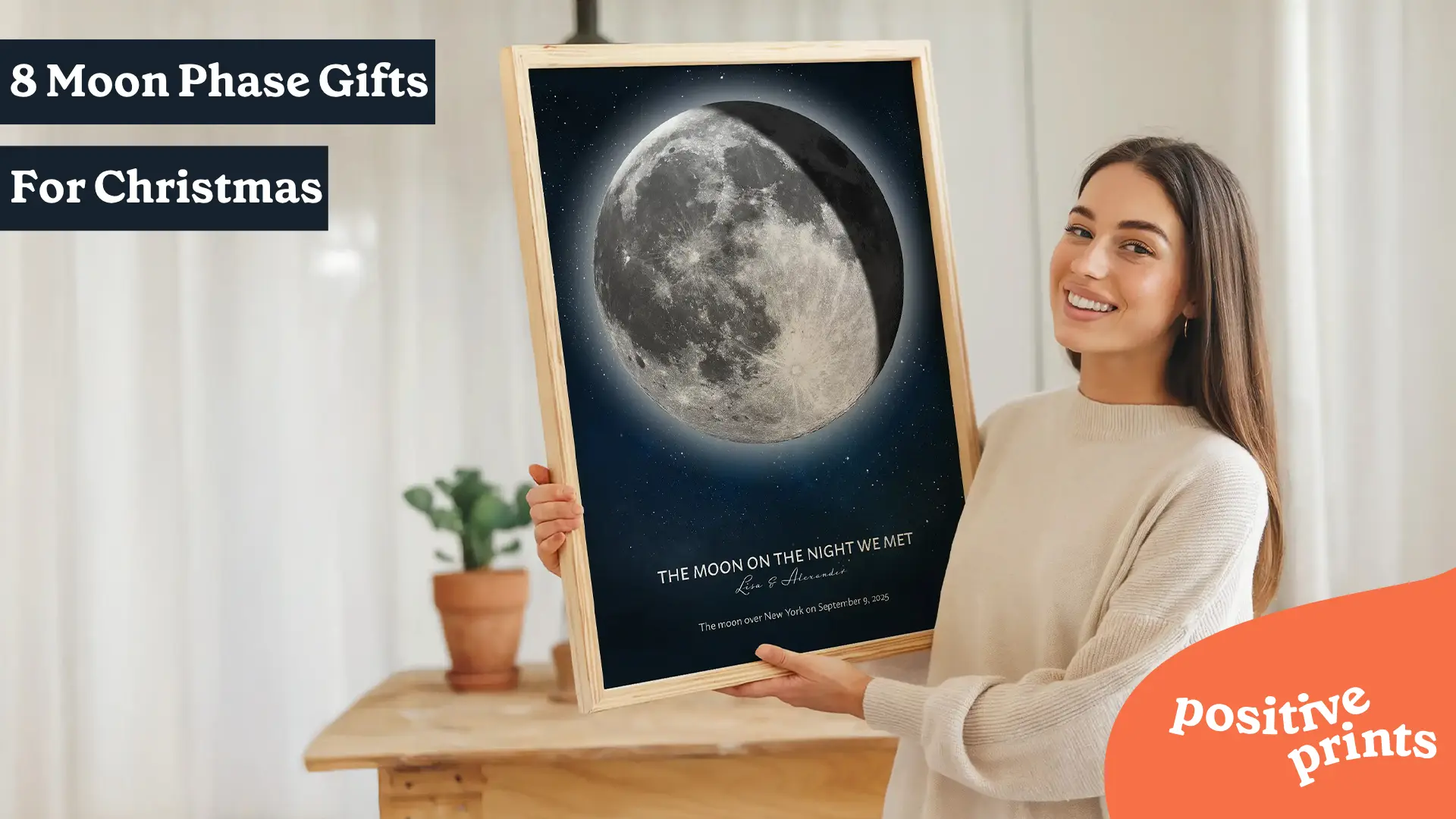 Woman holding a personalized moon phase print featured in a guide to 8 personalized moon phase gifts for Christmas.